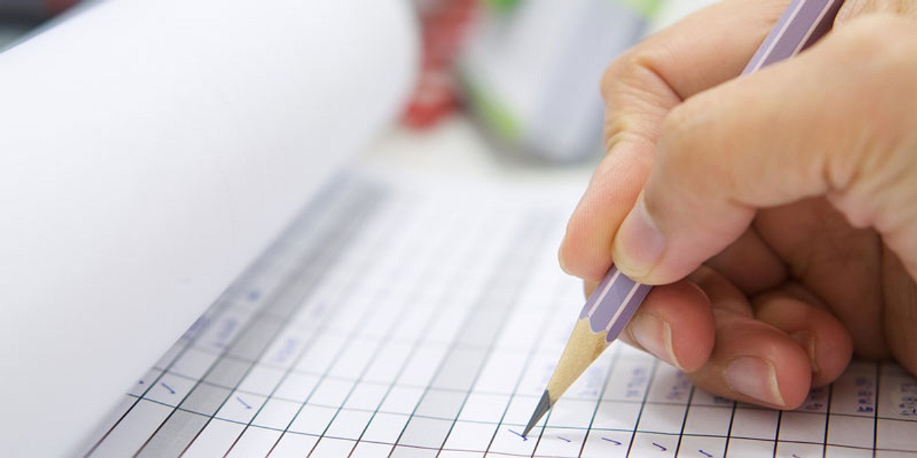 Stift und Checkliste