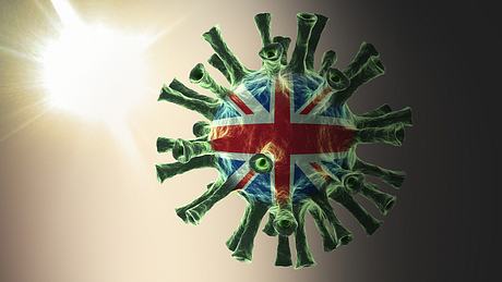 Darstellung eines Coronavirus mit britischer Flagge - Foto: iStock/s-cphoto